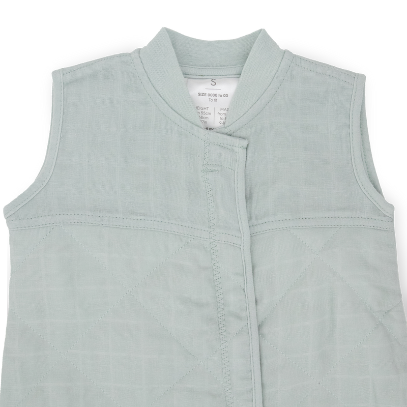 Close-up of Little Unicorn Cotton Muslin Quilted Sleep Bag - Sea Salt, breathable fabric ideal as a baby sleeping bag.