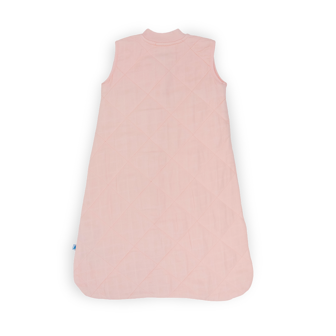 Styled nursery with Little Unicorn Cotton Muslin Quilted Sleep Bag - Light Pink, baby sleep bag perfect for bedtime.