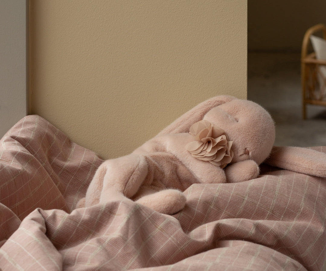 Maileg Sleeping Bunny small powder plush resting on bedding for nursery decor and gentle play
