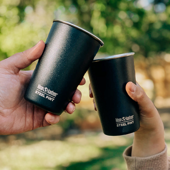 Group toasting with Klean Kanteen 16oz Pint Cup Four Pack in Black, metal and dishwasher safe.