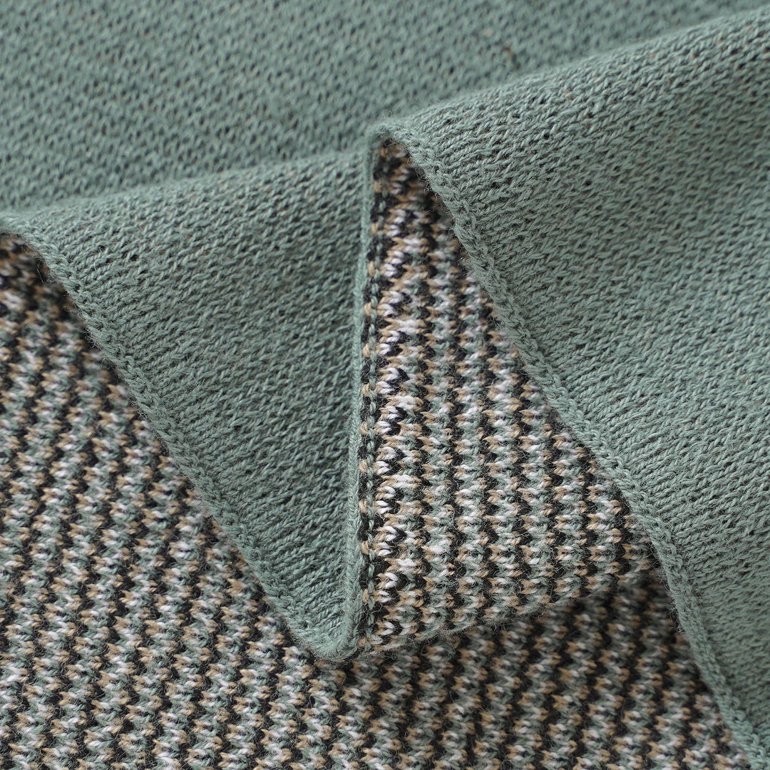 close up of sift cotton weave of the blue la la green deer newborn blanket 