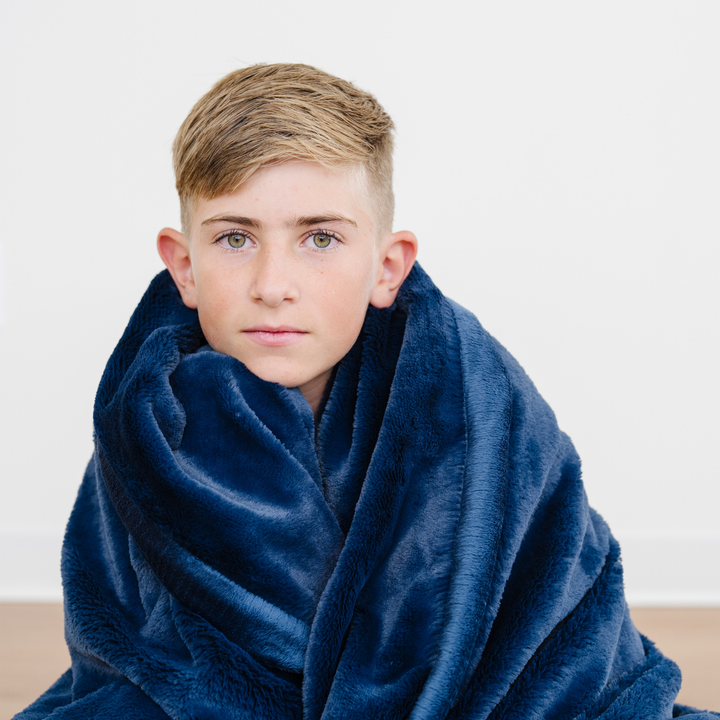 Offer your toddler warmth with the Saranoni Lush Toddler Blanket in Navy, a best toddler blankets pick.