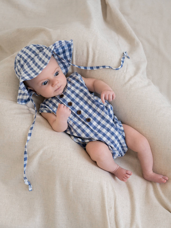 Colored Organics Wren Seersucker Bubble Romper. Made from 100% organic cotton, this blue gingham baby romper is soft, breathable, and eco-friendly.