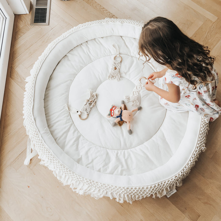 The Finn + Emma Organic Round Play Mat offers soft, safe comfort for tummy time or playÑan ideal baby play mat for every stage.
