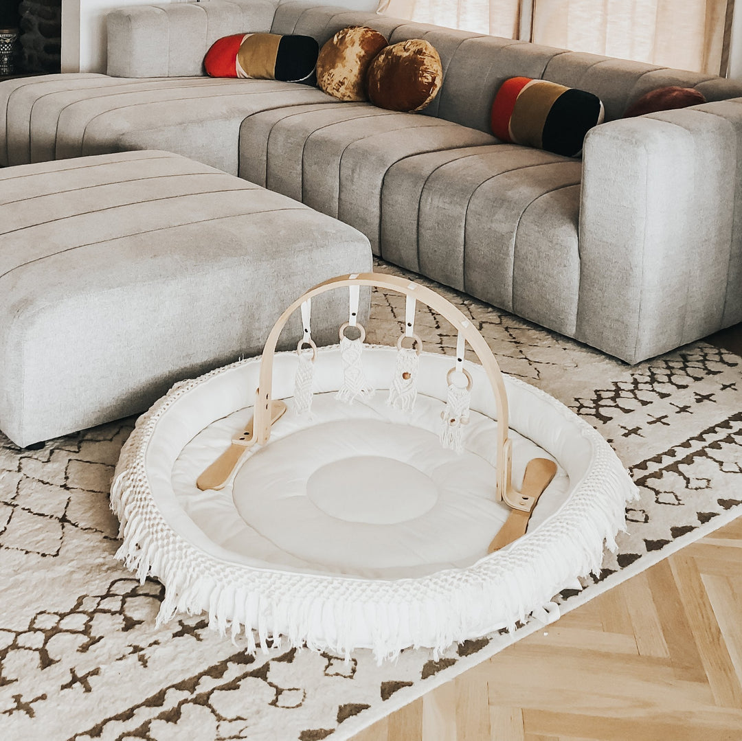 The Finn + Emma Organic Round Play Mat blends style and softness, making it one of the best play mats for babies to relax and explore.
