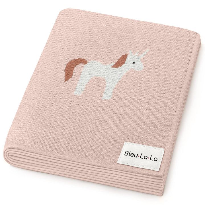 Bleu La La knit unicorn blanket folded neatly, soft cotton baby blanket with whimsical unicorn design