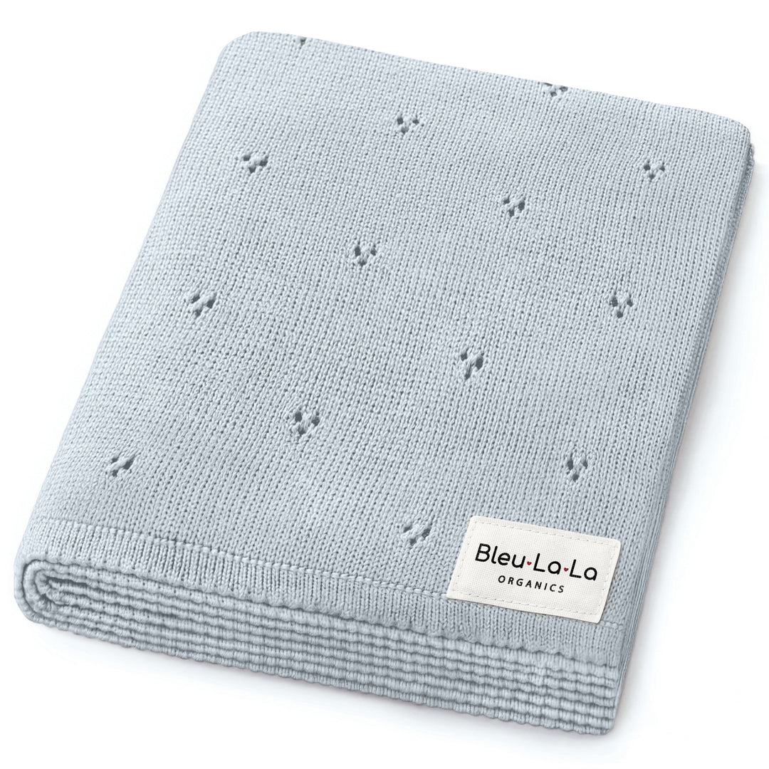 Bleu La La Organic Pointelle Luxury Knit Swaddle Blanket in powder blue, folded to show airy pointelle knit and organic cotton texture.