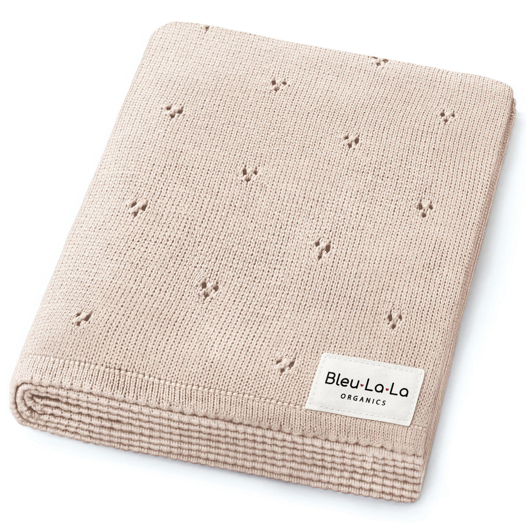 Bleu La La Organic Pointelle Luxury Knit Swaddle Blanket in oatmeal, folded to highlight durable organic cotton knit.