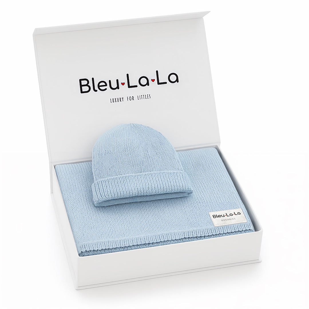 Bleu La La luxe gift box open with light blue organic cotton knit baby blanket and matching hat set
