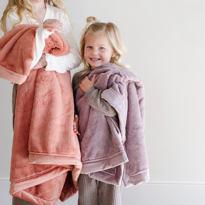 Infants stay snug with the Bloom Lush Receiving Blanket by Saranoni, a top choice for best toddler blankets.