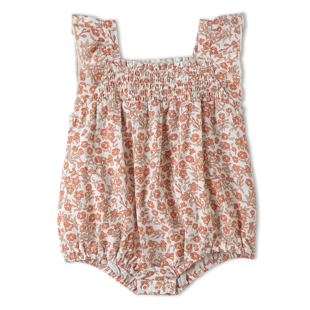 Baby wearing MakeMake Organics Sienna Ruffle Romper - GOTS certified warm-toned infant one-piece