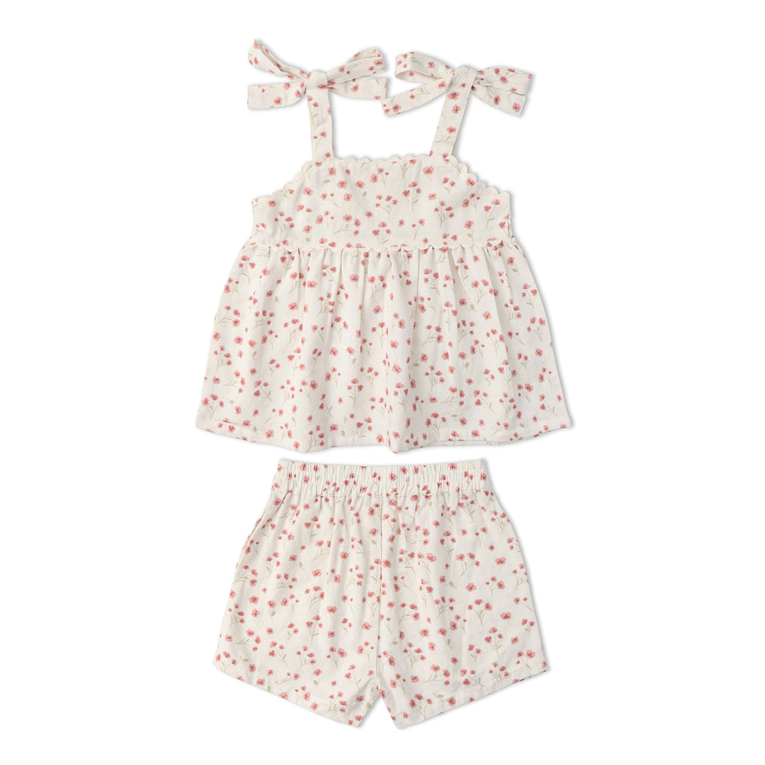 Toddler wearing MakeMake Organics Pink Bloom Tie Up Set - GOTS certified floral toddler separates