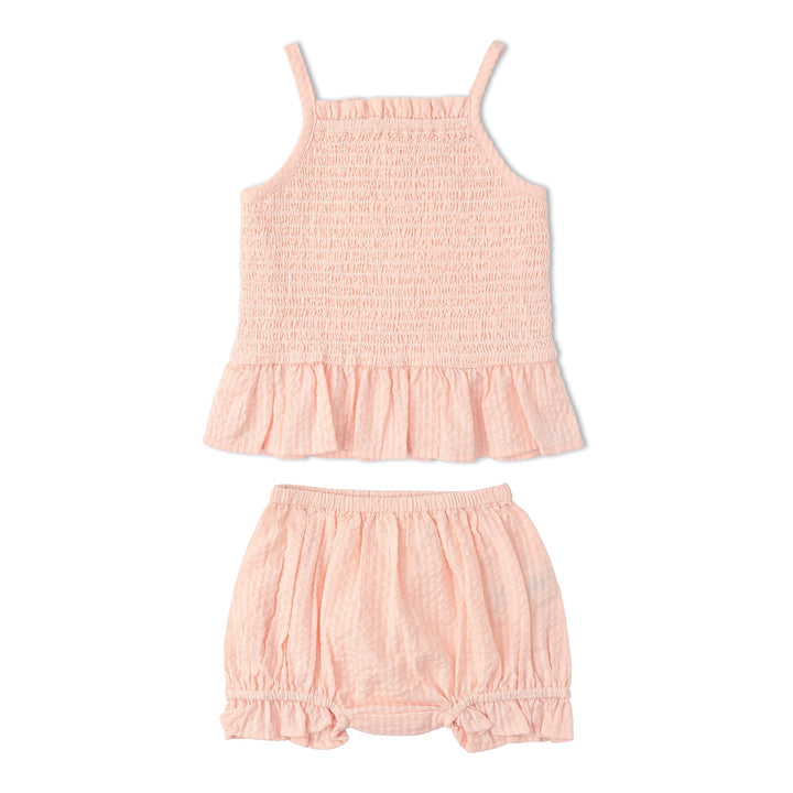Baby in MakeMake Organics Blush Smocked Bloomer Set - heirloom organic cotton infant set