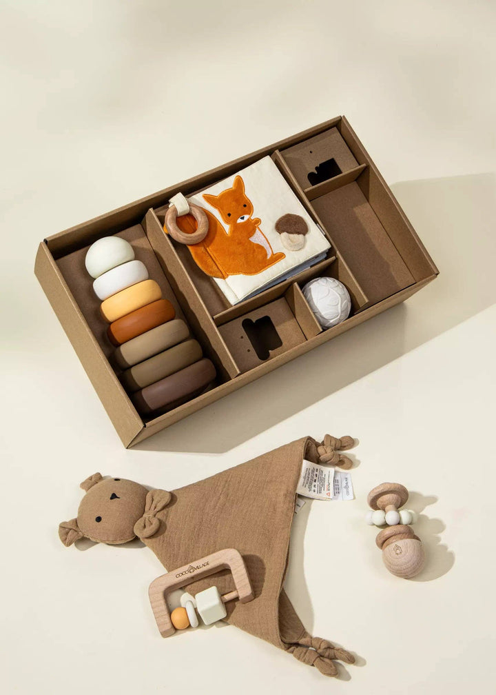 From rattle to ring, the Coco Village Baby First Toys Gift Box delivers a complete collection of first toys designed for newborn development.