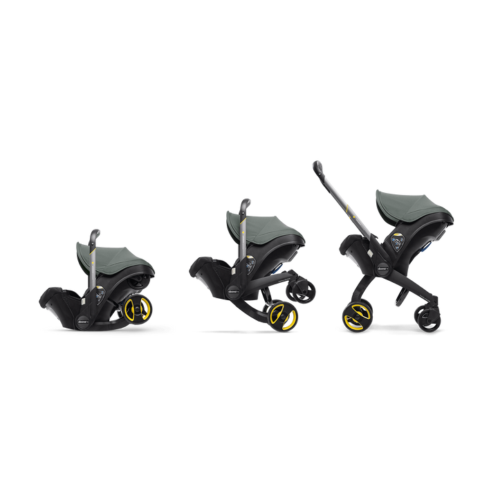 Switching from car seat to stroller, the Doona Infant Car Seat and Stroller in Slate Green is a smart travel solution.
