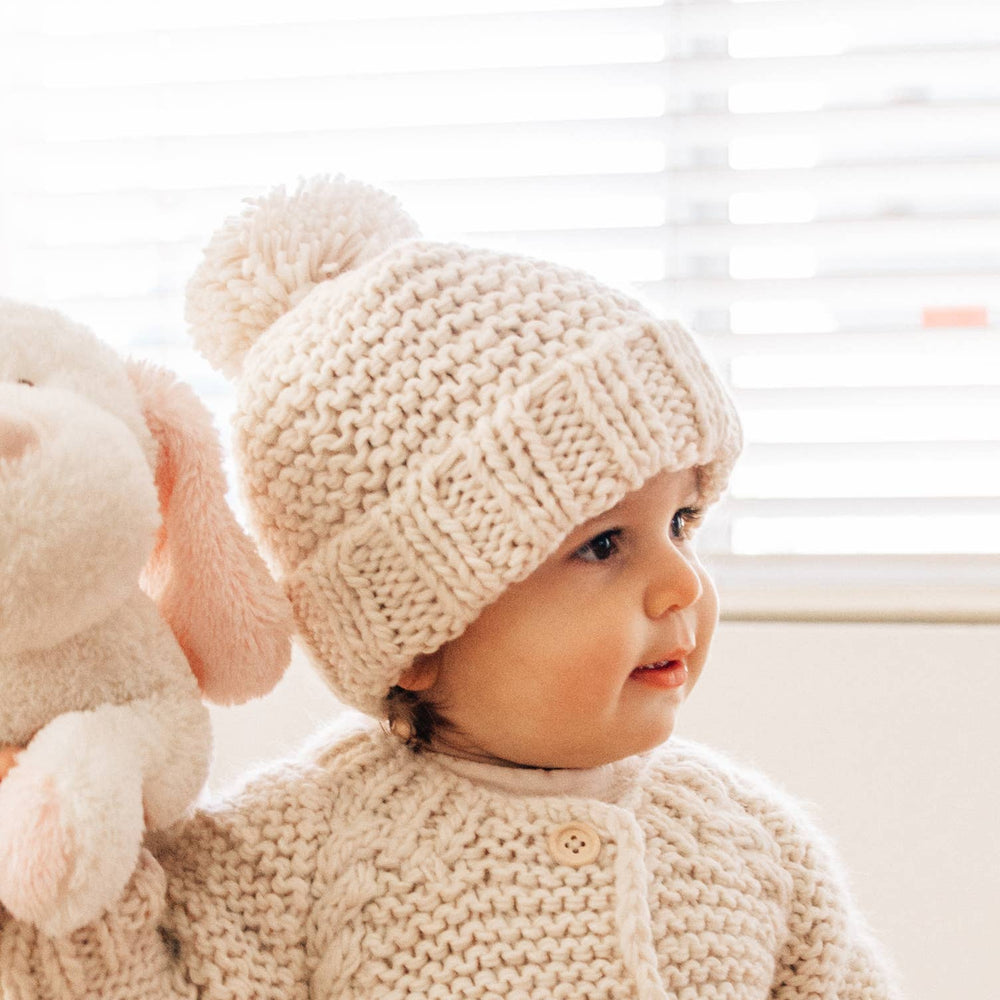 Keep little ones warm with the Huggalugs Natural Garter Stitch Beanie Baby & Kids, perfect baby winter hat.