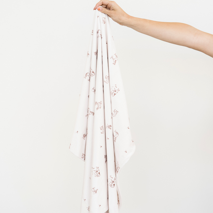 Soft yet durable, the Saranoni Minky Stretch Receiving Blanket in Farm Animals makes one of the best baby blankets for daily use.