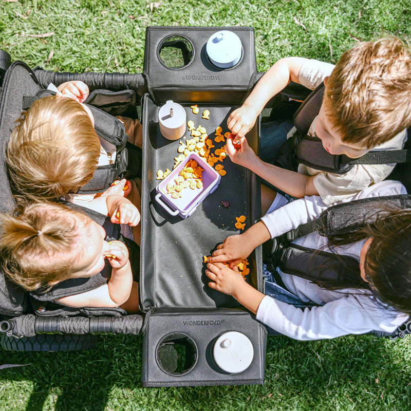 Side view of the Wonderfold W4 Flex Snack Tray, enhancing convenience in your kids wagon stroller setup.