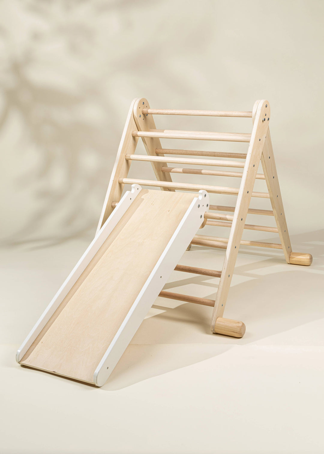 Coco Village Montessori 2-in-1 Grip Climber Board & Slide in Natural provides organic, open-ended activity for little climbers.