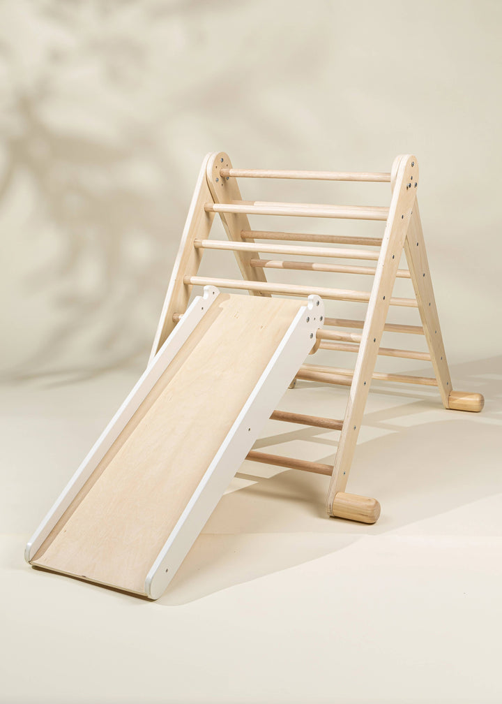 Coco Village Montessori 2-in-1 Grip Climber Board & Slide in Natural provides organic, open-ended activity for little climbers.