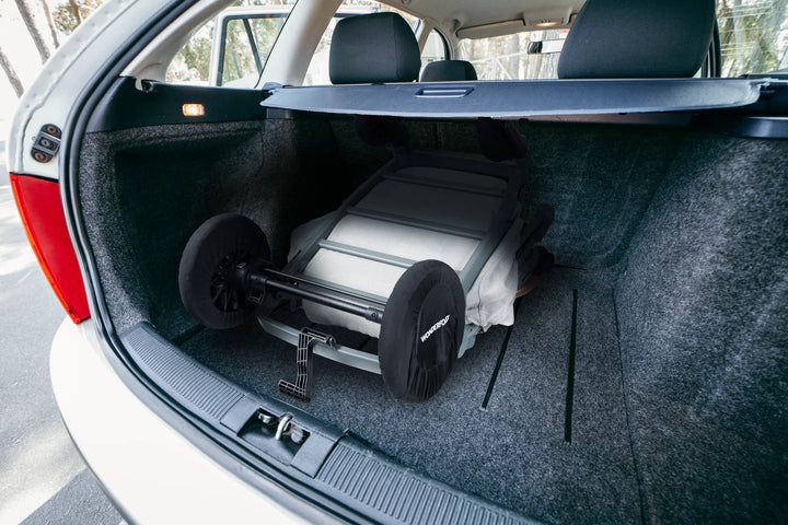Wonderfold Wheel Covers packed neatly in a car trunk, lifestyle shot highlighting best stroller accessories.