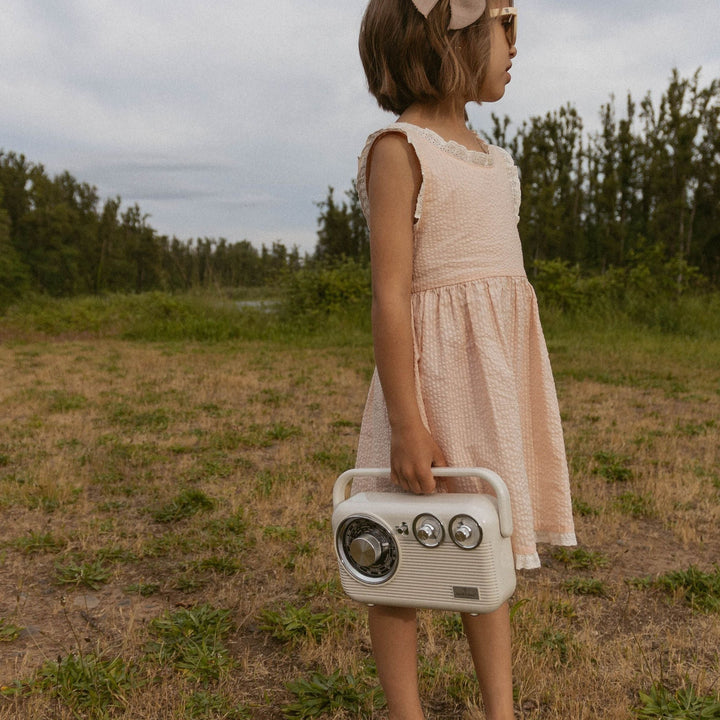 MakeMake Organics Blush Cross Back Dress lifestyle - soft organic cotton blush baby summer dress