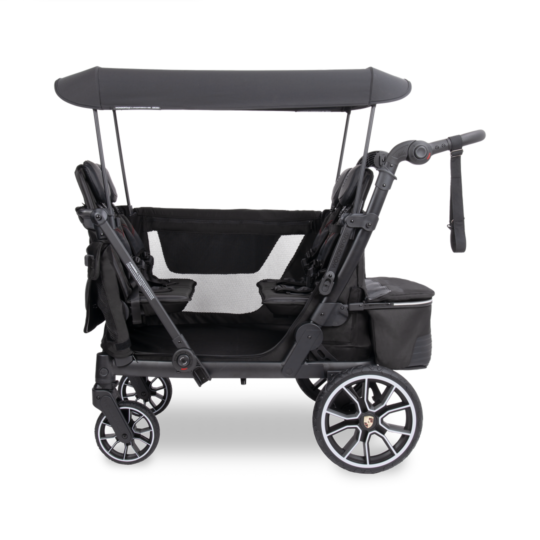 Bench seats with 5-point harnesses inside the WonderFold x Porsche L4 Quad Stroller Wagon