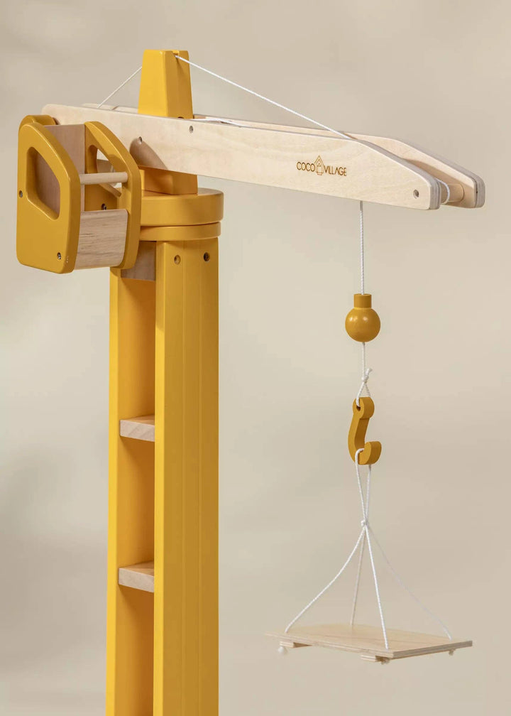 Made from natural wood, the Coco Village Oversized Wooden Construction Crane inspires hours of creative and purposeful construction play.
