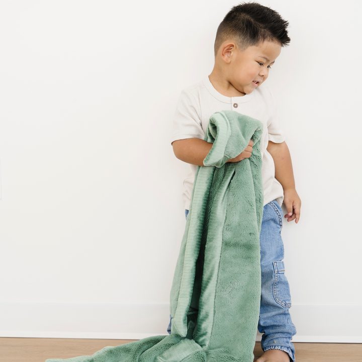 Bring comfort to your toddler with the Saranoni Lush Toddler Blanket in Seagrass, an ideal toddler blankets pick.
