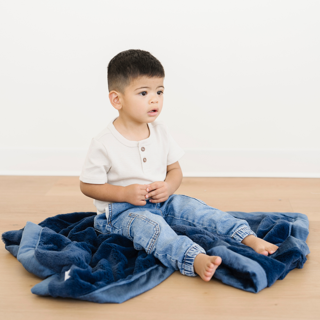 Little ones will love the Navy Saranoni Lush Receiving Blanket, perfect for snuggling as baby girl blankets.