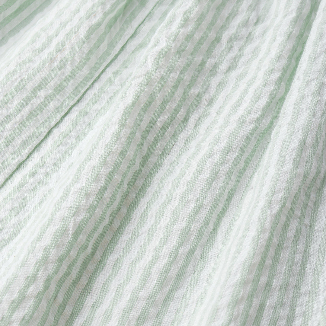 MakeMake Organics Flutter Jumpsuit Basil Stripes lifestyle - breathable seersucker toddler jumpsuit