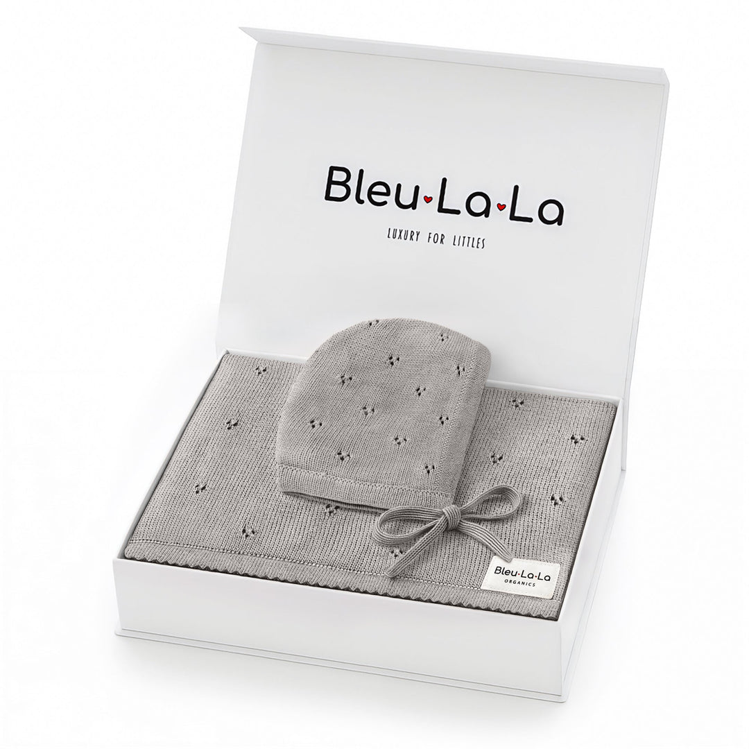 Bleu La La Organic Pointelle Swaddle Blanket + Hat Gift Set in dove grey, gift-ready box showcasing organic cotton softness.