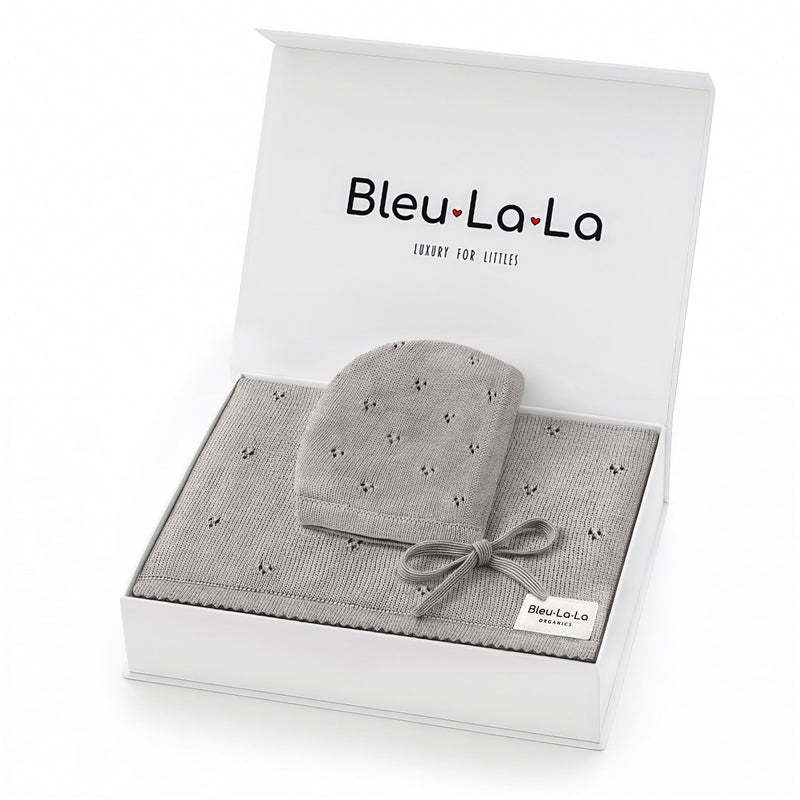 Bleu La La Organic Pointelle Swaddle Blanket + Hat Gift Set in dove grey, gift-ready box showcasing organic cotton softness.