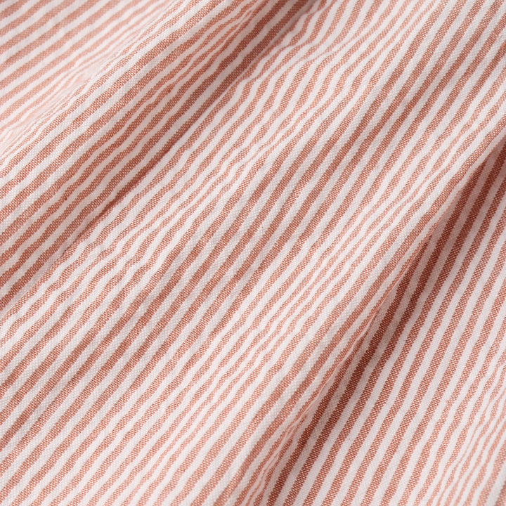 Organic coral stripe baby dress flat lay - MakeMake Organics cross back design toddler dress