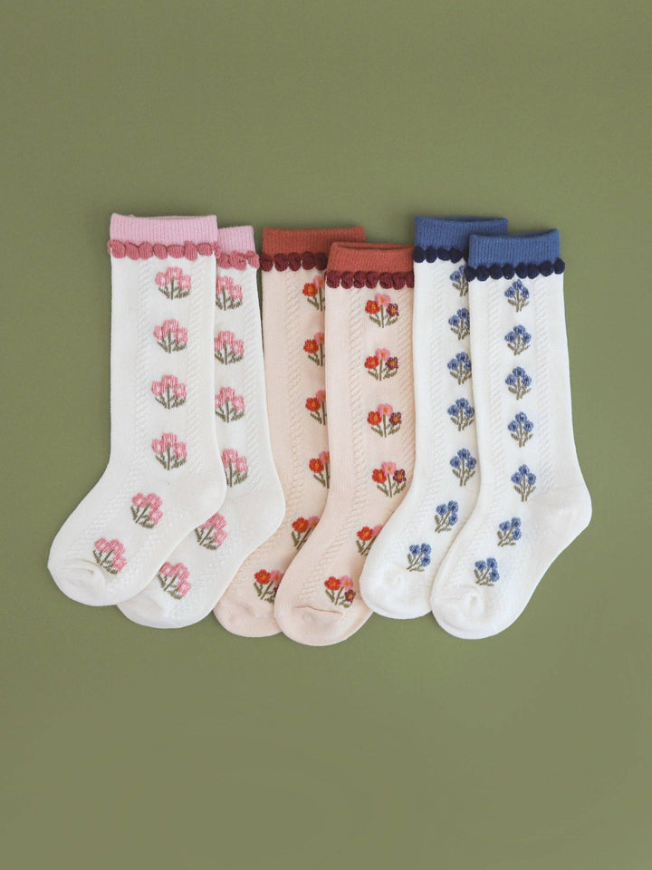 Little Stocking Co. Posie Knee Socks shown in Rust alongside other colorways, knit floral toddler knee socks