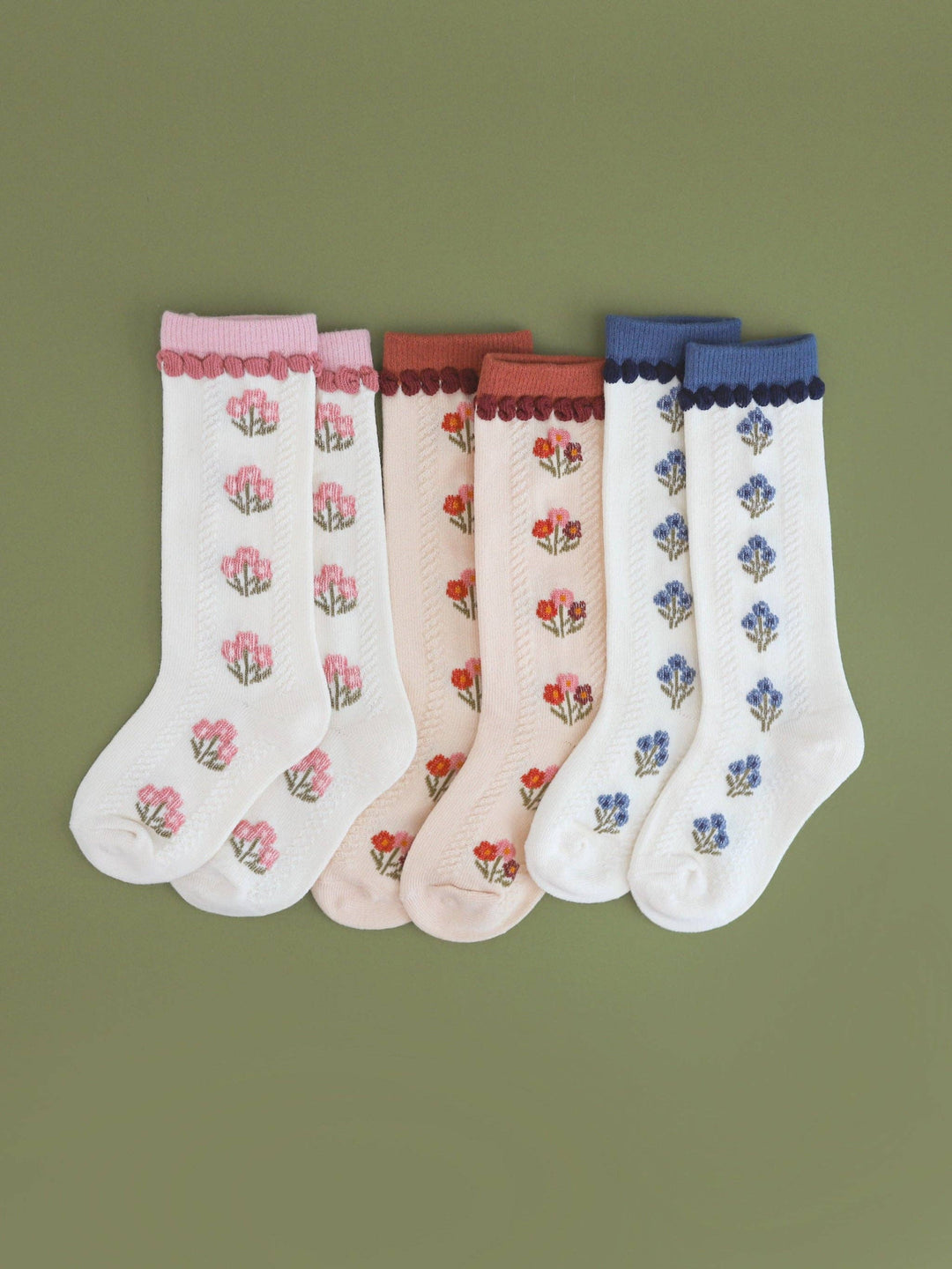 Little Stocking Co. Posie Knee Socks shown in Old Rose alongside other colorways, knit floral toddler knee socks