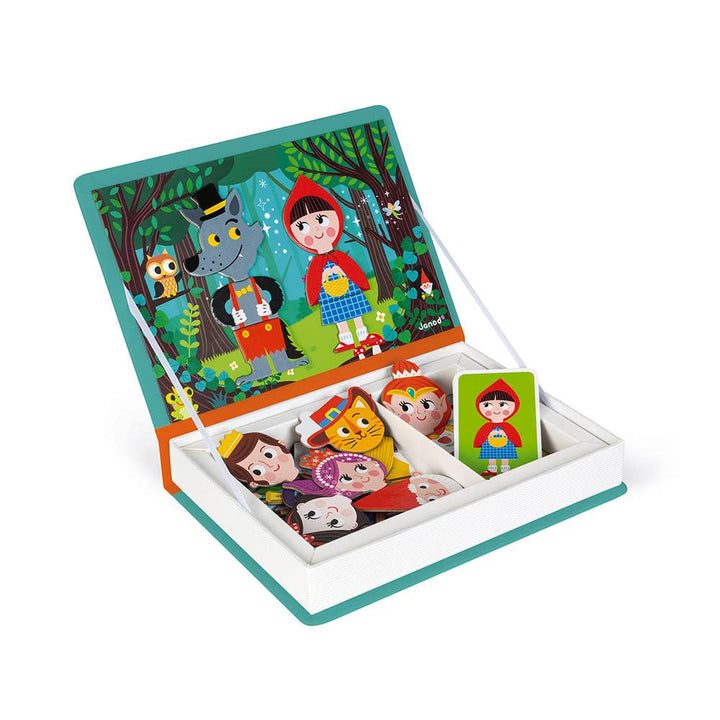 Child playing with magnetic toys pieces from Janod Magneti'book Fairy Tales