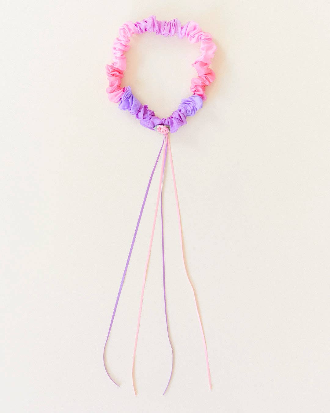 Sarah's Silks Blossom Garland lies flat, showing its silk rose and trailing ribbon streamers