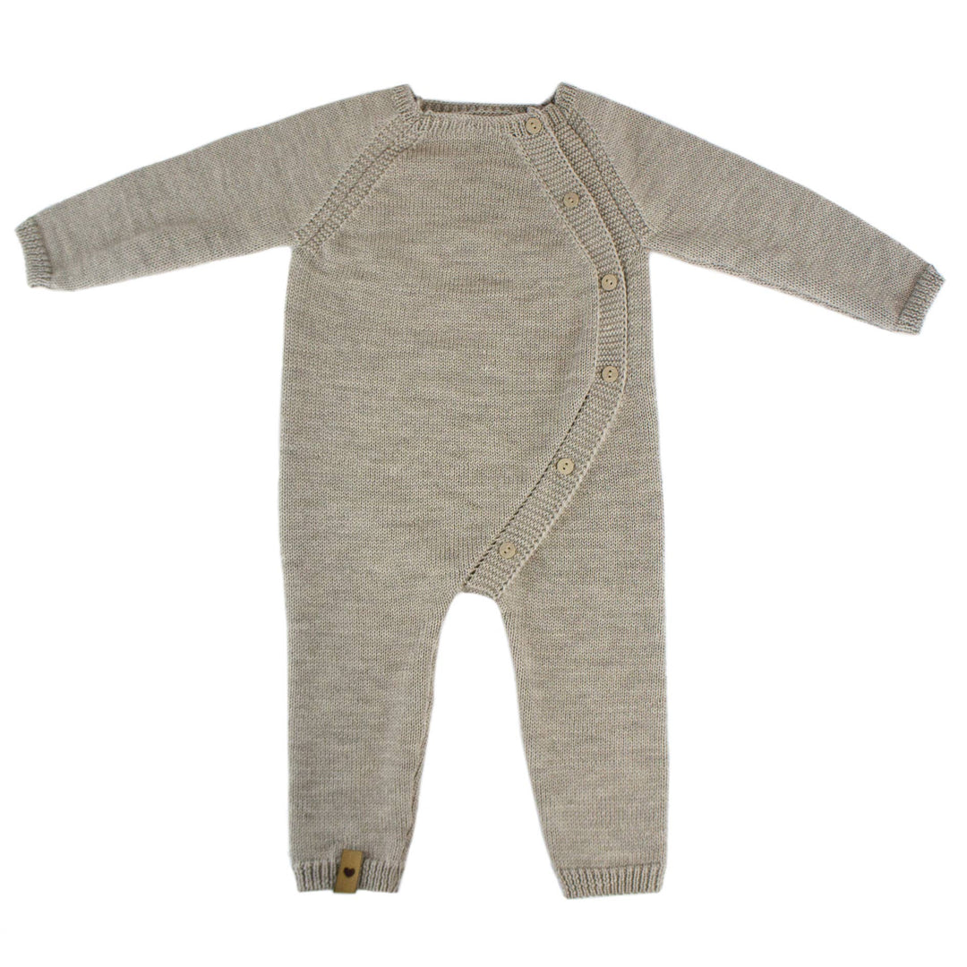 Beige knitted baby overall laid flat, ALIAP Merino Wool Plain Knit Baby Bodysuit, neutral natural fiber babywear