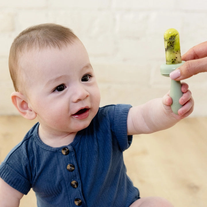 Sage EZPZ Baby-Ledª Gumline Feeder photographed in use, flexible silicone feeder baby for introducing purees