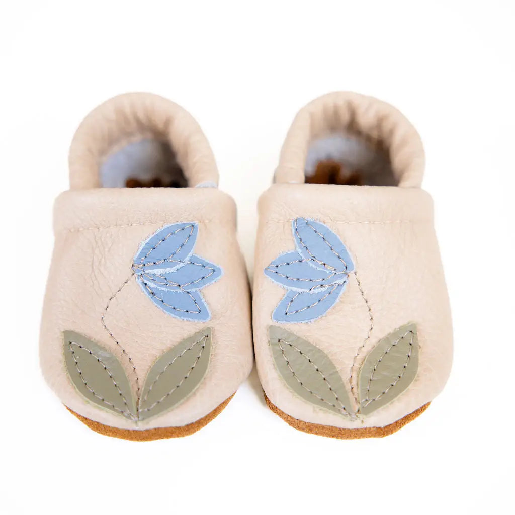starry knight design baby leather moccasins with blue bell flower design on barley colored moccasins 