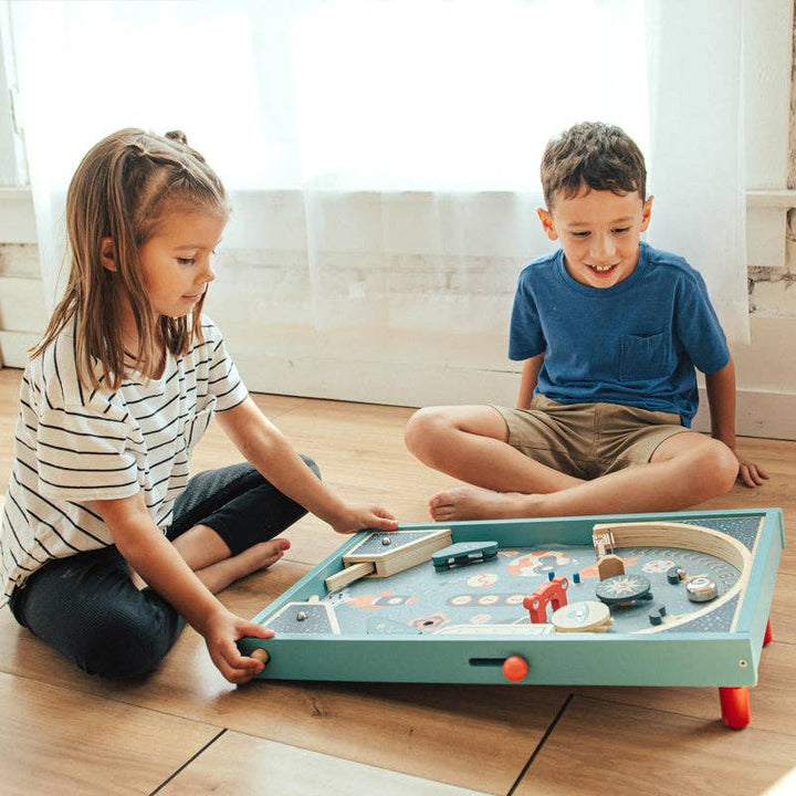 Blast Off Pinball by Wonder and Wise showing full playfield with spinning targets bells and scoring tiles for kids