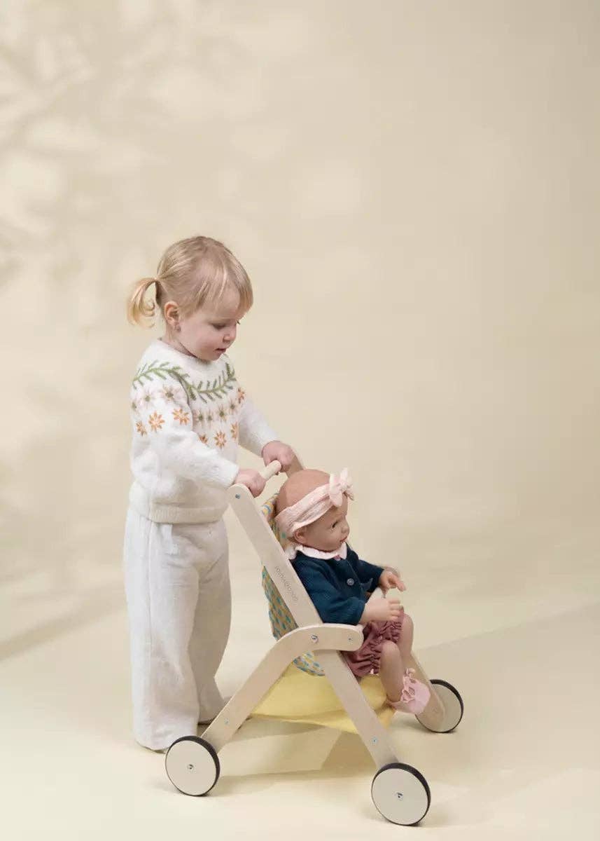 Toddlers playing with the Wooden Dolls' Stroller by Coco Village during imaginative playtime