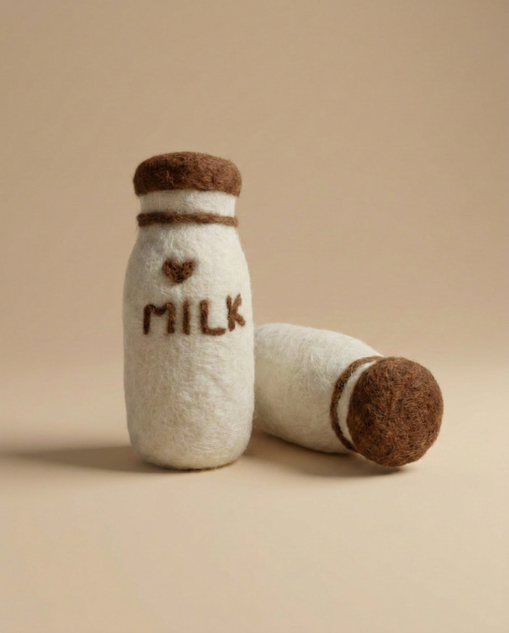 Kaddu Felt Milk Bottles shown standing and lying, ideal Montessori grocery play set