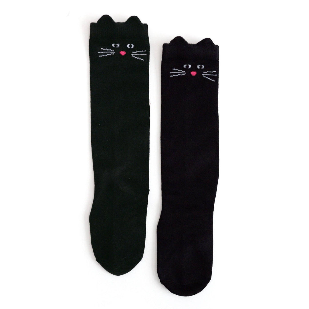 Girl wearing Little Stocking Co. Black Cat Knee High Socks with a pink tutu skirt and mary janes
