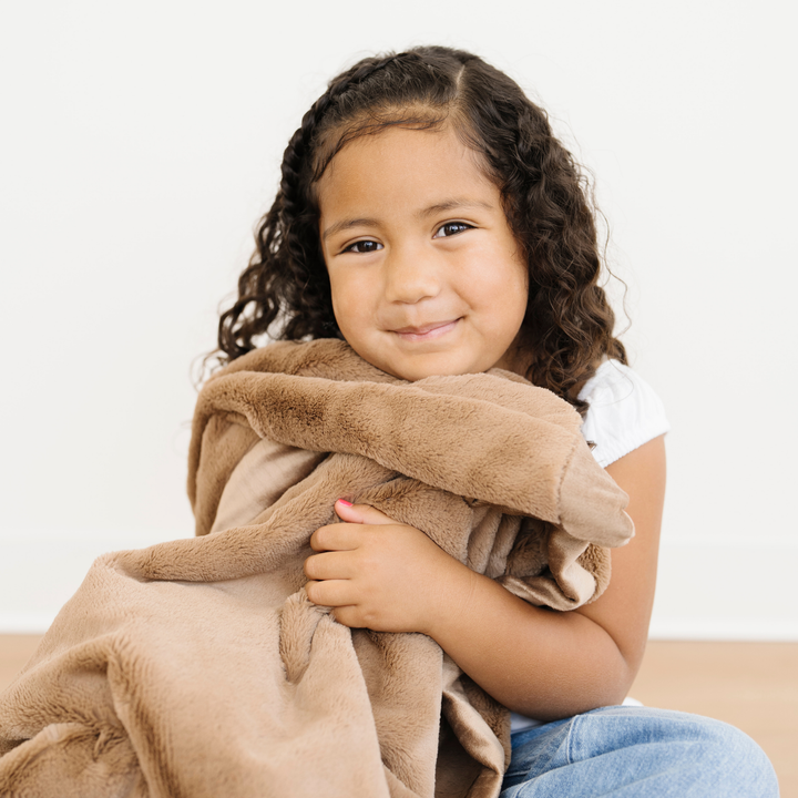 The Saranoni Lush Toddler Blanket in Hazelnut offers warmth and style as a toddler blanket everyone will love.