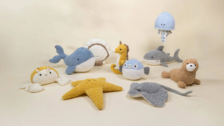 Pufferfish Plush Toy pictured with other Coco Village sea creature plush toys including a whale and starfish