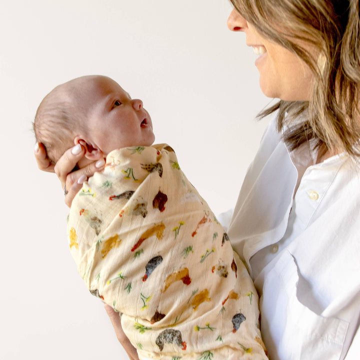 1canoe2 Chicken Meadows baby swaddle wrapped snugly around infant, farmhouse print muslin swaddle blanket