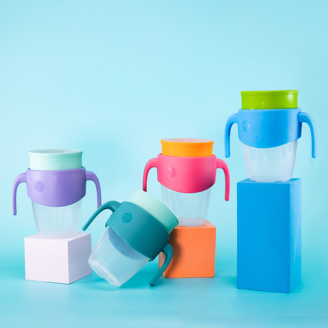 lineup of 360 training cups by bbox against blue background