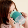 toddler drinking from b.box 360 rim training cup